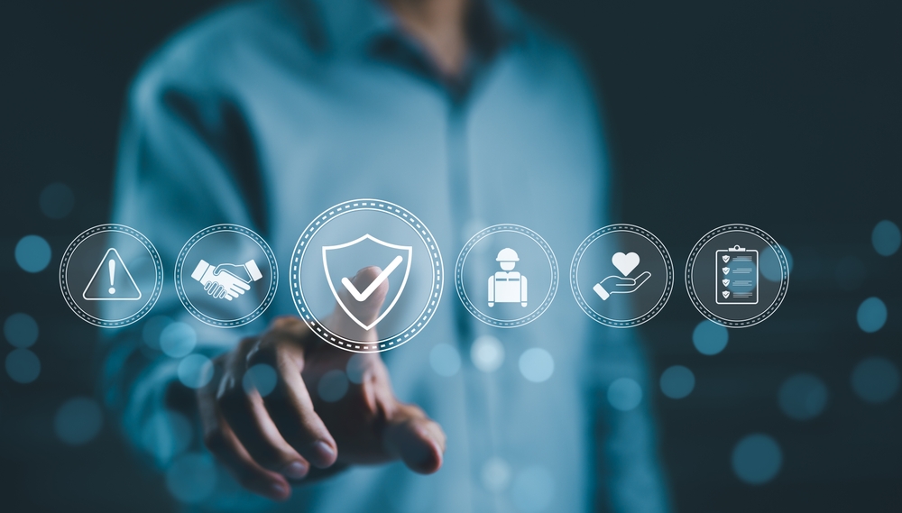 A person with work safety and compliance icons, including a shield, hard hat, checklist, workplace safety, health protocols, and regulatory compliance